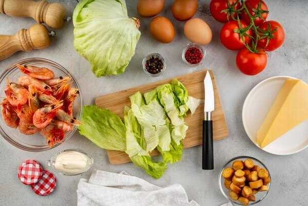 Fresh ingredients arranged on a kitchen table in soft natural light
